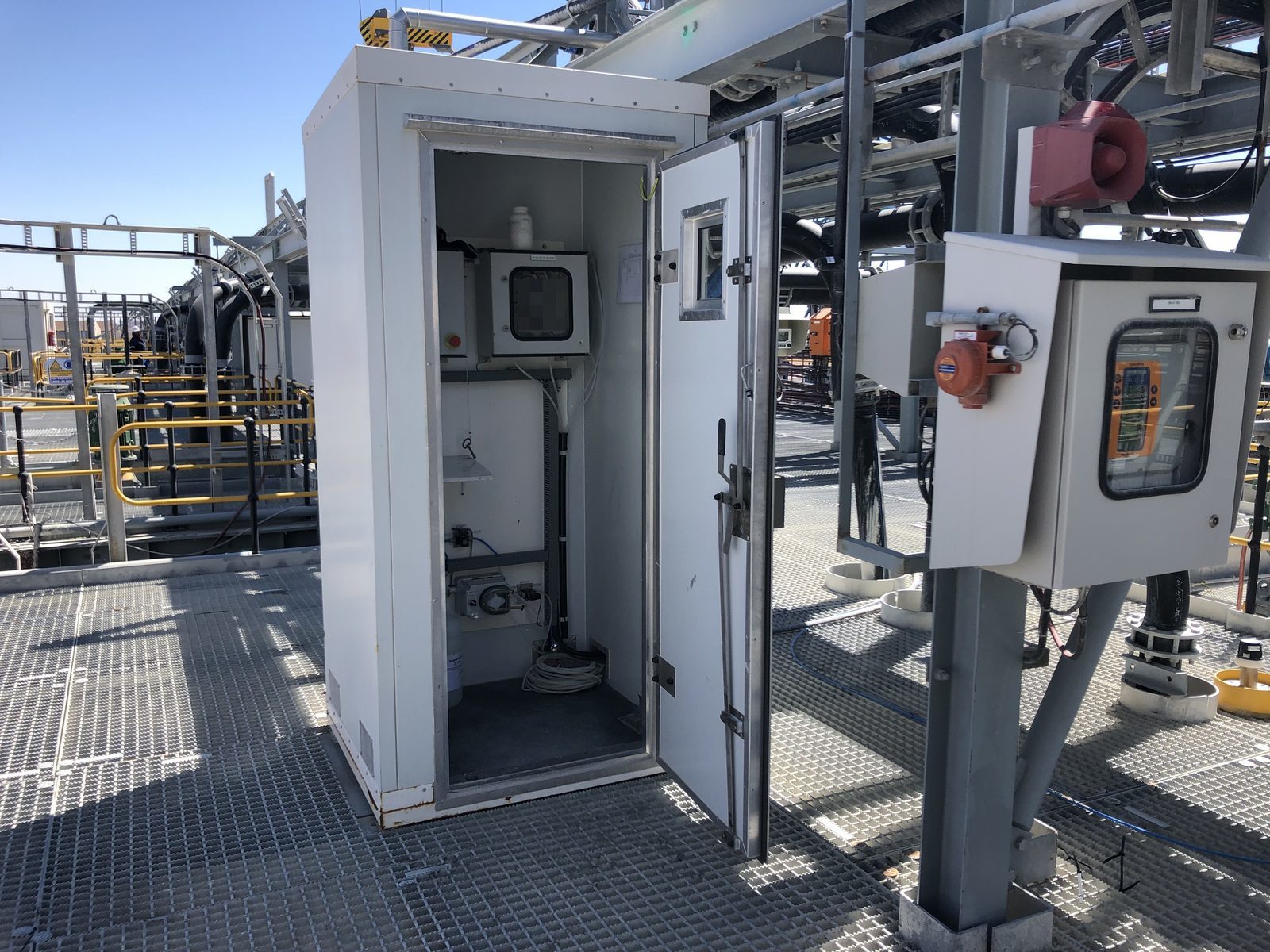PAS analyser control booth installed within a processing plant structure